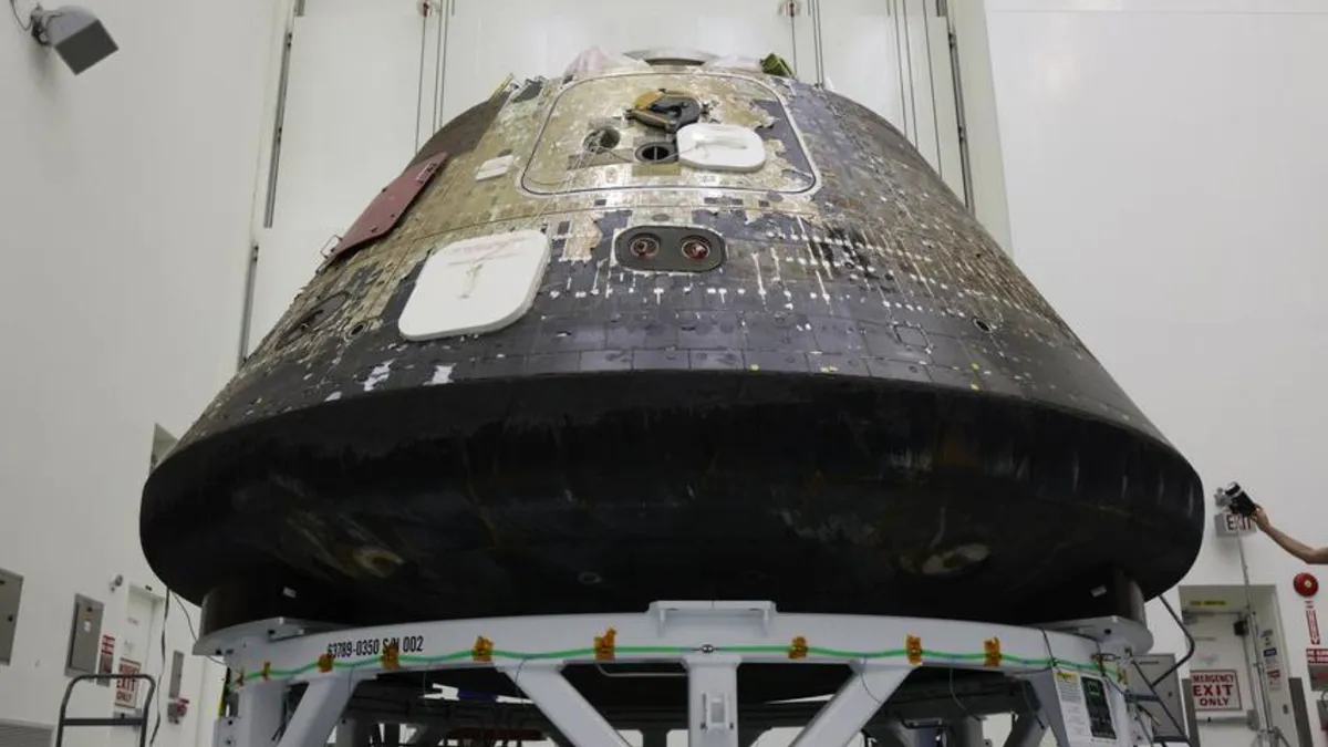 The Artemis 2 Orion capsule at Kennedy Space Center, showing heat damage from atmospheric reentry