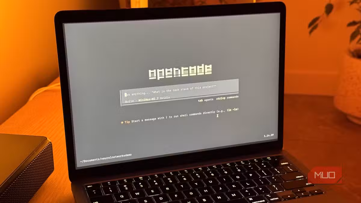 OpenCode running in the terminal on a MacBook