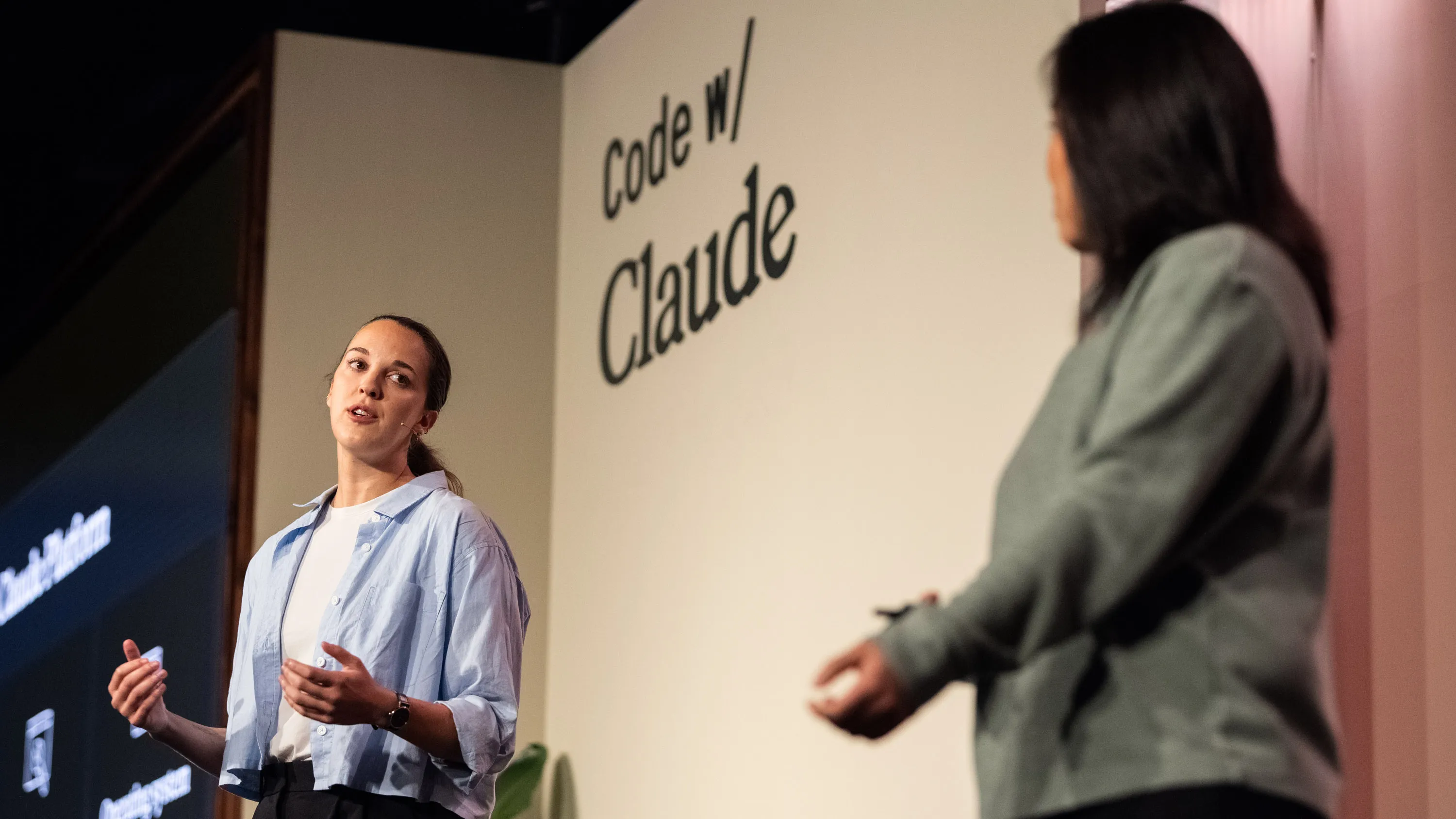 two speakers on stage at the Code with Claude event in London