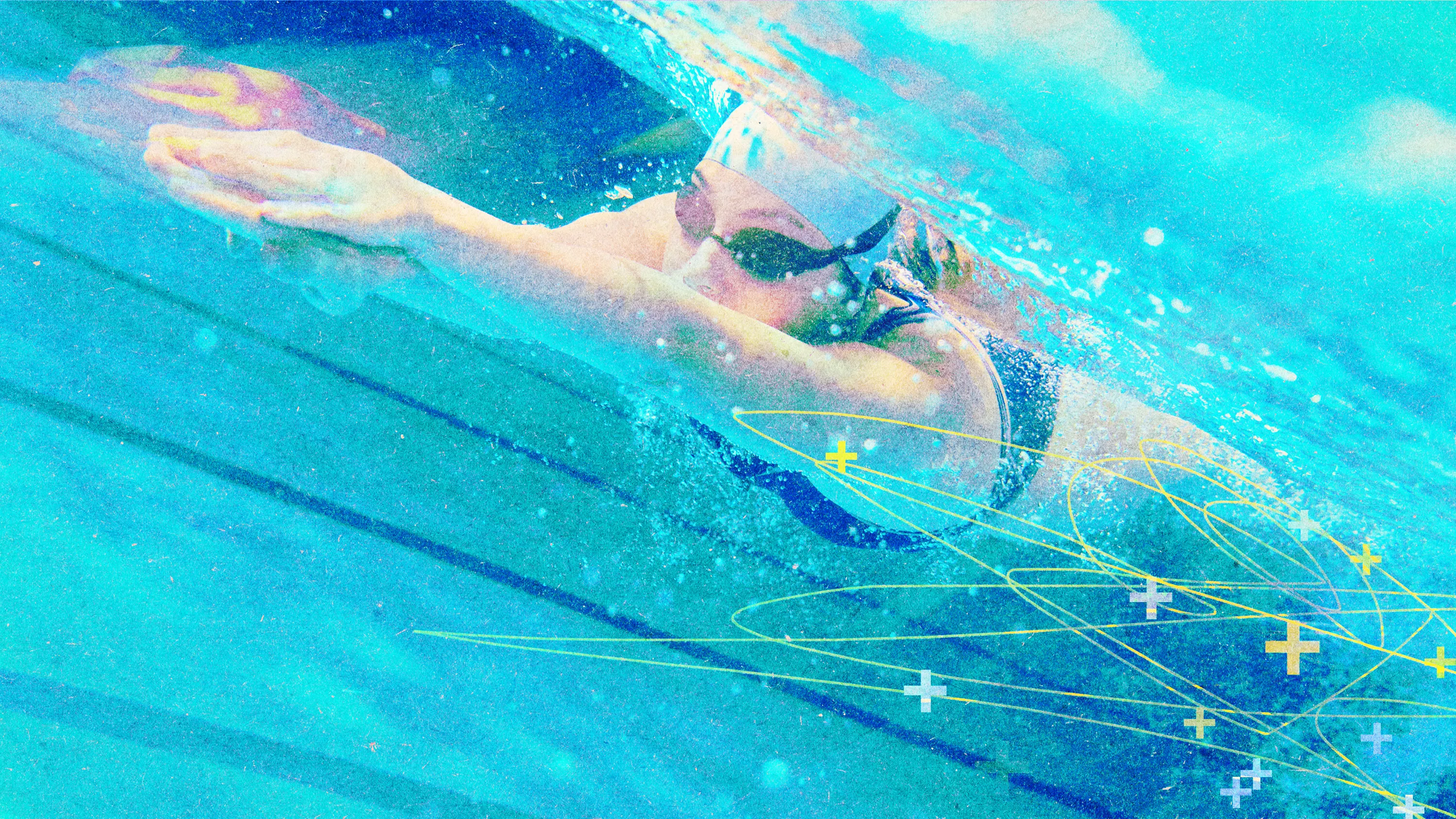 a swimmer underwater with plus symbols around their body