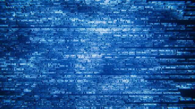 Lines of programming code scrolling up on a dark screen background
