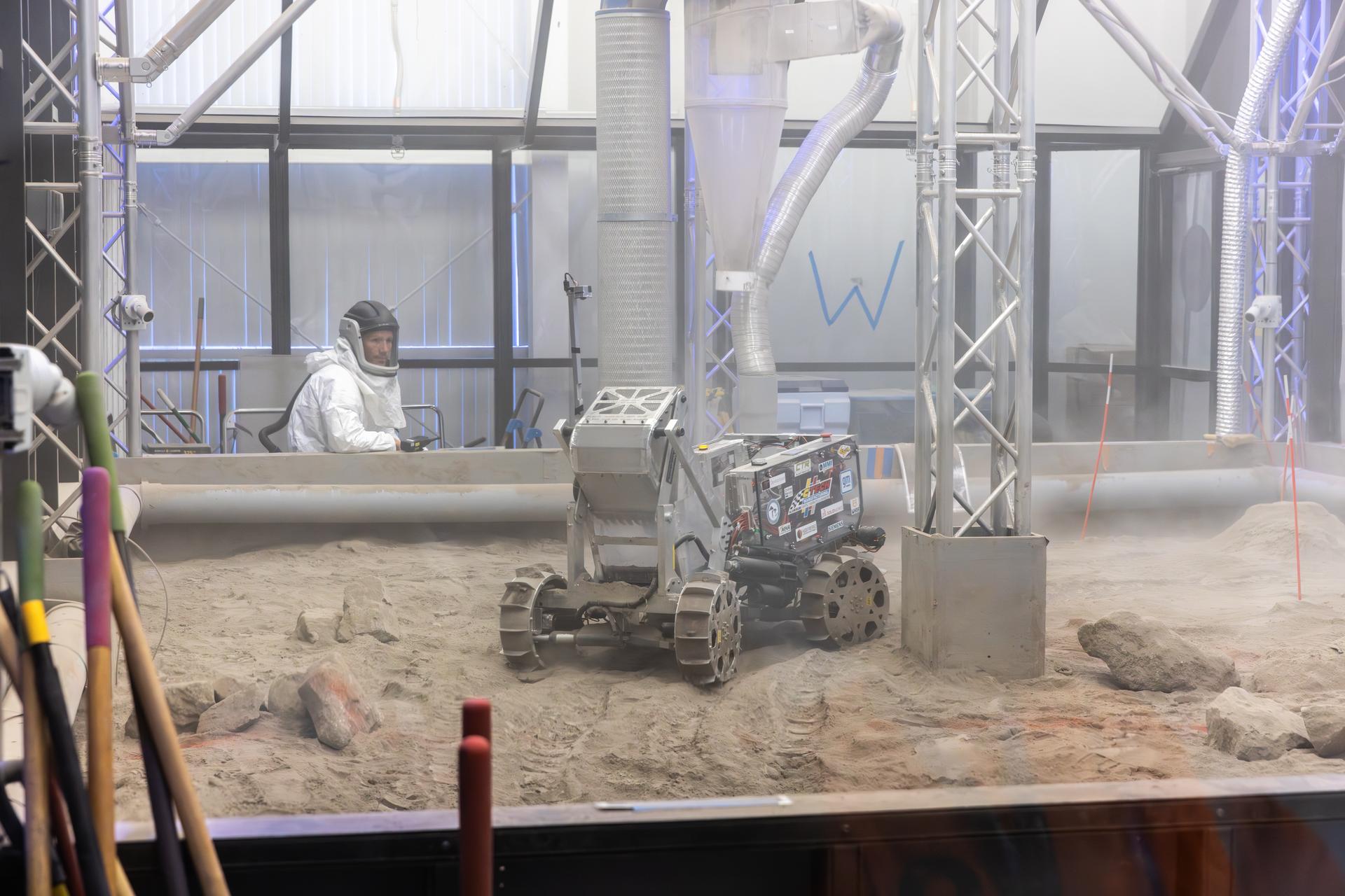 A student team's robot demonstrates lunar soil excavation during the final competition round