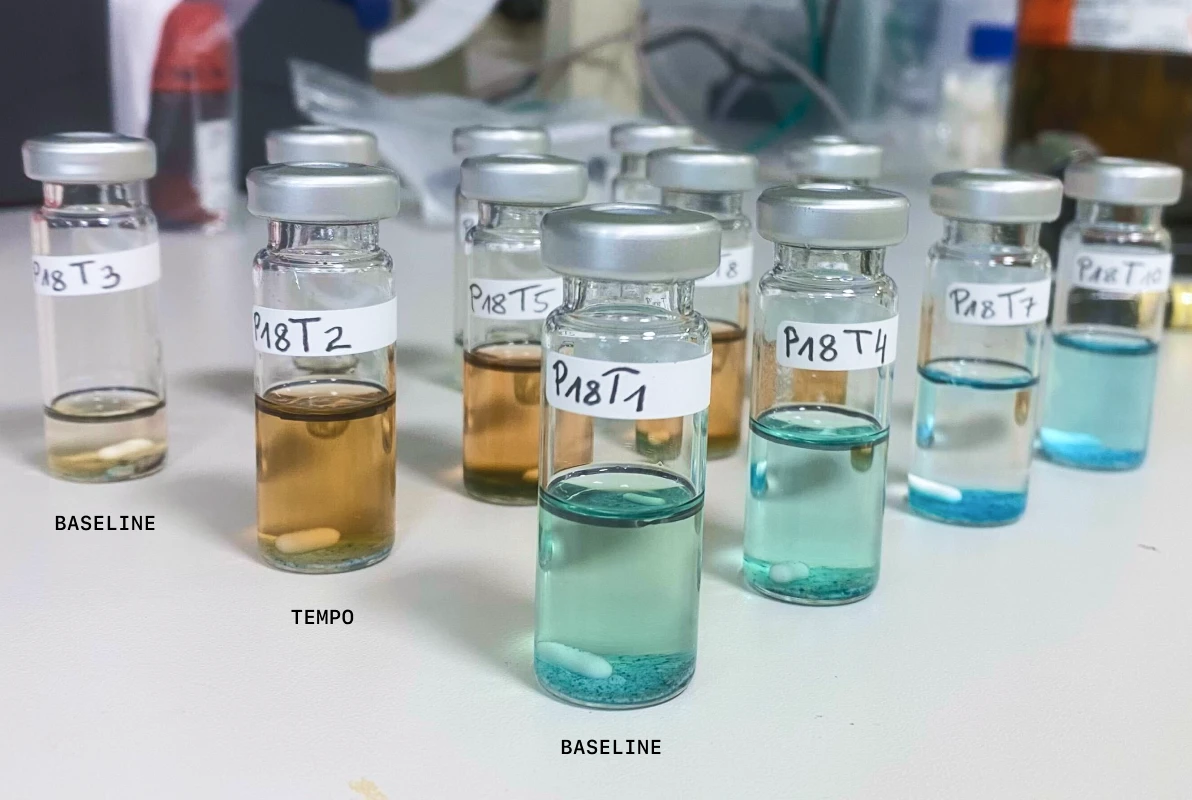 Labeled glass reaction vials from Molecule.one bench-scale validation experiments.